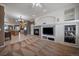 Inviting living room with fireplace, built-in shelving, and open access to kitchen at 21753 E Heritage Pkwy, Aurora, CO 80016