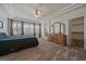 Serene main bedroom with tray ceilings, lots of light, and a walk-in closet at 21753 E Heritage Pkwy, Aurora, CO 80016