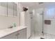 Bright bathroom with walk-in shower, modern vanity, and contemporary fixtures at 2310 Squires Ct, Longmont, CO 80501