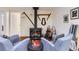 Intimate fireplace with unique decor and mantle in a finished basement setting at 2310 Squires Ct, Longmont, CO 80501