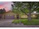 Charming single-Gathering home featuring a large mature tree in the front yard and a two-car garage at 2310 Squires Ct, Longmont, CO 80501