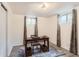 Basement office space featuring a table with storage and natural light from the windows at 2310 Squires Ct, Longmont, CO 80501