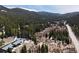Stunning aerial view of a wooded neighborhood nestled among towering pine trees and mountain slopes at 4192 Highway 9 # 3, Breckenridge, CO 80424