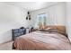 Bedroom with natural light, neutral tones, and exterior views from the window at 4192 Highway 9 # 3, Breckenridge, CO 80424