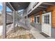Exterior view of condo building with stairs and walkway, plus snowy ground at 4192 Highway 9 # 3, Breckenridge, CO 80424