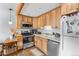 Charming kitchen with wood cabinets, stainless steel appliances and breakfast nook at 4192 Highway 9 # 3, Breckenridge, CO 80424