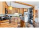 Cozy kitchen features wood cabinets, stainless steel appliances, and stone-look tile flooring at 4192 Highway 9 # 3, Breckenridge, CO 80424
