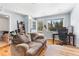 Cozy living space featuring hardwood floors and a workspace bathed in natural light at 4192 Highway 9 # 3, Breckenridge, CO 80424