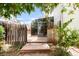 Backyard featuring a private deck and a charming sunroom, perfect for outdoor relaxation at 4034 S Atchison Way, Aurora, CO 80014