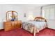 Bright bedroom with a cozy bed, large window, and vanity with mirror at 4034 S Atchison Way, Aurora, CO 80014