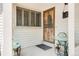 Inviting front porch with seating area and decorative security door enhancing curb appeal at 4034 S Atchison Way, Aurora, CO 80014