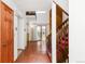 Spacious living room with hardwood floors, staircase, and glass door access to outdoor area at 4034 S Atchison Way, Aurora, CO 80014
