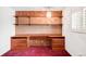 Bright office space offering a built-in desk, shelving, and ample room with light filtering through a window at 4034 S Atchison Way, Aurora, CO 80014