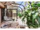 Bright sunroom with glass ceiling, ceiling fan, and access to the outdoors at 4034 S Atchison Way, Aurora, CO 80014