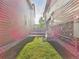 Wide angle view of the backyard with artificial turf between two homes at 9236 E 52Nd Dr, Denver, CO 80238