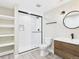 Modern bathroom features a glass enclosed shower, and modern vanity at 9236 E 52Nd Dr, Denver, CO 80238