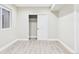 Finished bedroom with closet, woodgrain flooring and an egress window at 9236 E 52Nd Dr, Denver, CO 80238