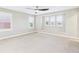 Spacious bedroom featuring neutral walls, carpet flooring, modern ceiling fan, and bright windows at 9236 E 52Nd Dr, Denver, CO 80238