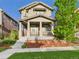 Charming two-story home with inviting front porch and well-maintained landscaping and nice curb appeal at 9236 E 52Nd Dr, Denver, CO 80238
