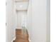 Clean hallway with wood floors leading to various rooms, offering a glimpse into the layout at 9236 E 52Nd Dr, Denver, CO 80238