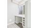 Basement office nook with built in desk, shelves and a window with coverings at 9236 E 52Nd Dr, Denver, CO 80238