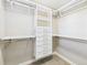 Bright walk-in closet with custom shelving and drawers providing ample storage solutions at 9236 E 52Nd Dr, Denver, CO 80238