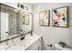 Modern bathroom with white cabinets and black accents at 7870 W 87Th Dr # L, Arvada, CO 80005