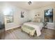 Bright bedroom with light walls and a comfy bed at 7870 W 87Th Dr # L, Arvada, CO 80005