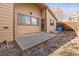 Cozy home exterior featuring a backyard patio, fenced yard, and unique architectural details at 3333 E Florida Ave # 108, Denver, CO 80210