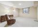 Empty basement with carpet flooring and natural light at 3333 E Florida Ave # 108, Denver, CO 80210