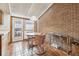 Charming breakfast nook with brick walls, light and bright from the patio door at 3333 E Florida Ave # 108, Denver, CO 80210