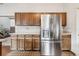 Kitchen featuring the stainless steel refrigerator, and lots of counter space at 3333 E Florida Ave # 108, Denver, CO 80210