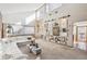 Bright living room featuring high ceilings, and an eye-catching gallery wall at 3333 E Florida Ave # 108, Denver, CO 80210