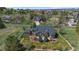 A sprawling estate featuring a well-manicured lawn and patio in a tranquil, scenic setting at 19770 E Geddes Pl, Centennial, CO 80016