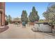 A backyard patio featuring an outdoor seating area and hot tub, perfect for relaxation and entertainment at 19770 E Geddes Pl, Centennial, CO 80016