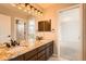 Contemporary bathroom featuring dual sinks, granite vanity, and sleek lighting at 19770 E Geddes Pl, Centennial, CO 80016