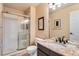 Elegant bathroom featuring a glass shower, granite vanity, and modern fixtures at 19770 E Geddes Pl, Centennial, CO 80016
