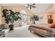 Bright primary bedroom with vaulted ceilings and sliding glass doors to the patio at 19770 E Geddes Pl, Centennial, CO 80016