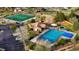 An aerial view of community pool, tennis courts, clubhouse, playground and parking area at 19770 E Geddes Pl, Centennial, CO 80016