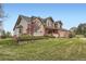 Beautifully landscaped front yard with a well-maintained lawn and charming two-story home at 19770 E Geddes Pl, Centennial, CO 80016