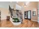 Grand foyer with hardwood floors, staircase, and modern chandelier at 19770 E Geddes Pl, Centennial, CO 80016