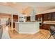 Modern kitchen with stainless steel appliances, breakfast bar, and plenty of natural light at 19770 E Geddes Pl, Centennial, CO 80016