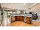 Gourmet kitchen featuring stainless steel appliances, wood floors and breakfast nook at 19770 E Geddes Pl, Centennial, CO 80016