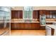Gourmet kitchen with stainless steel appliances and wood floors at 19770 E Geddes Pl, Centennial, CO 80016