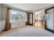 Bright room with large window and French doors leading to another room at 19770 E Geddes Pl, Centennial, CO 80016