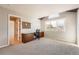 Well-lit office space featuring a large window, plush carpeting, and lots of cabinet space at 19770 E Geddes Pl, Centennial, CO 80016