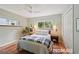 Inviting bedroom with a cozy bed, bedside tables, and natural light streaming through the windows at 2965 S Gilpin St, Denver, CO 80210