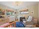 Charming Bedroom with a crib, comfortable armchair, and whimsical decor for a cozy atmosphere at 2965 S Gilpin St, Denver, CO 80210