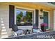 Inviting front porch with chairs and decor, perfect for relaxing and enjoying the neighborhood at 2965 S Gilpin St, Denver, CO 80210