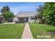Charming home with a well-maintained front yard, inviting walkway, and lovely curb appeal at 2965 S Gilpin St, Denver, CO 80210